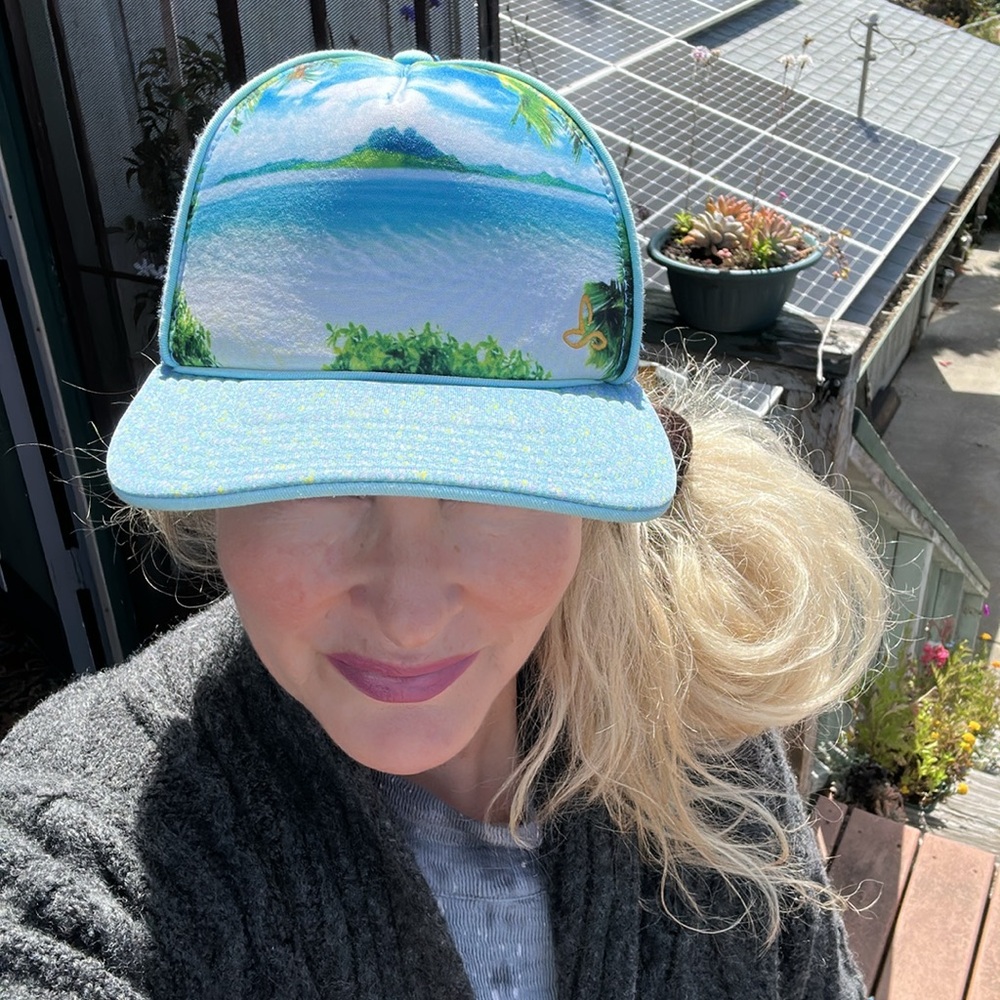 Prana Trucker Hat🏝beach scene and Bora Bora in the background. Darling hat